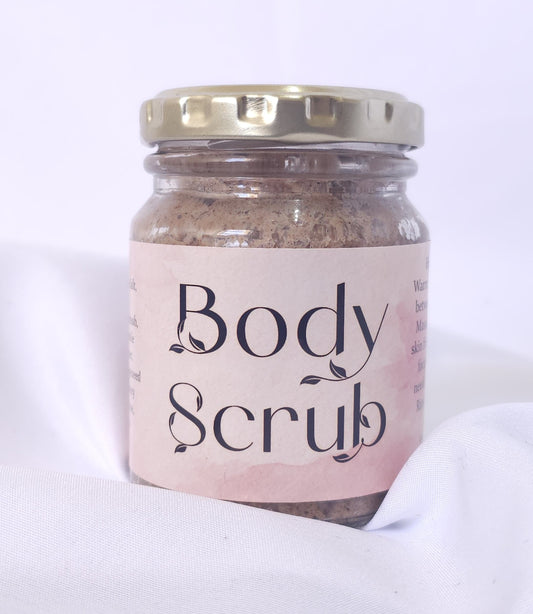 Jar of body scrub with a pink label on a white background